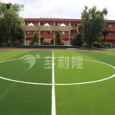 フットボール競技場のための緑色で長持ちする草草